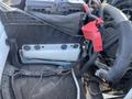 A 2016 Ford F-250 SD engine compartment showing the battery and wiring connected to various components