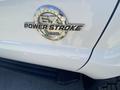 2016 Ford F-350 SD with a chrome emblem displaying the words 57 Power Stroke B20
