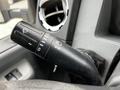 Close-up of the windshield wiper control stalk in a 2016 Ford F-550 showing various switch symbols for wipers and headlights