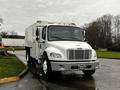 A white 2007 Freightliner M2 106 truck with a boxy cargo area and front grille featuring multiple horizontal slats