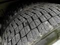 Close-up of a tire on a 2009 Spartan Gladiator showcasing detailed tread patterns and grooves designed for traction and durability