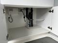 A 40 foot custom climate controlled storage container with a white interior containing plumbing connections and fixtures