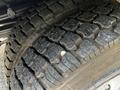 Close-up of a tire on a 2016 Ford F-550 showcasing deep tread patterns and texture