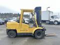 A yellow 2000 Hyster 120 forklift with a black mast and forks positioned for lifting