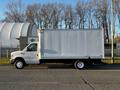 A 2017 Ford Econoline box truck with a white exterior and a sturdy construction in a side profile view