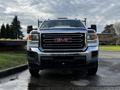 A 2017 GMC Sierra 3500HD pickup truck with a prominent chrome grille and red GMC logo in the center facing forward