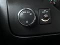 Dashboard controls featuring a round light switch with an auto setting and a dome light switch on a 2017 Chevrolet Express