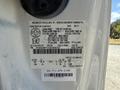 Close-up of a 2012 Ford F-450 SD VIN label displaying vehicle specifications and manufacturing details
