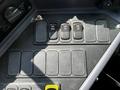 Control panel with several black switches labeled REAR and FRT on a textured surface