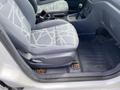 A 2013 Ford Transit Connect interior showing a driver's seat with patterned fabric and a gear shifter on the center console