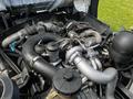 Close-up of the engine of a 2009 Ford LCF 550 showcasing various components including pipes valves and a turbocharger
