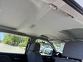 Interior view of a 2016 GMC Sierra 1500 showing the ceiling and front seats with light fixtures above