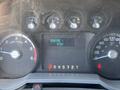 Dashboard of a 2012 Ford F-450 SD showing engine RPM speedometer fuel gauge and odometer displaying 8707 miles