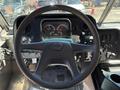 The interior view of a 2019 Freightliner MT45 showing the steering wheel dashboard and control panel with gauges and buttons