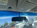 Interior view of a 2013 Ford Expedition featuring the rearview mirror and part of the overhead console