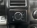 Interior dashboard controls of a 2016 Ford F-150 featuring a rotary switch for selecting 2H 4H and 4L drive modes