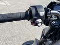 Close-up of the right handlebar controls of a 2018 Triumph Street Triple RS including switches for indicators and mode selection