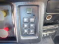 Control panel of a 2005 Ford F-750 featuring gear shift buttons labeled P R N D and mode selection buttons