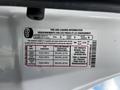 Tire and loading information label for a 2010 Ford Ranger detailing dimensions and pressure for front and rear tires