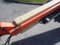 Close-up of a 2008 JLG Boom Lift arm showing orange and beige sections with bolts and cables visible
