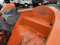 An orange 2008 Fassmer 20 Foot Fast Rescue boat interior featuring a console with controls and a set of two benches against the back wall