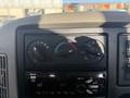 Dashboard controls of a 2017 International 4300 featuring climate control knobs and a radio with AM functionality