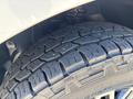 Close-up of a tire from a 2019 Mercedes-Benz Sprinter showcasing detailed tread patterns and grooves