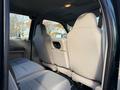 Interior of a 2008 Ford F-550 showing gray fabric seats in the back and a clean, modern design with a focus on seating arrangement