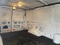 2011 Ford Econoline cargo van interior showing empty space with bare walls and floor