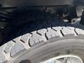 Close-up of a tire on a 2016 Ford F-550 showing a rugged tread pattern designed for durability and traction