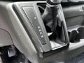 Gear shift lever of a 2022 Ford Transit featuring positions for park reverse neutral drive and manual