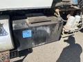 Hydraulic oil tank mounted on a 2007 International 7300 with a blue label reading HYD OIL and a visible cap and fittings
