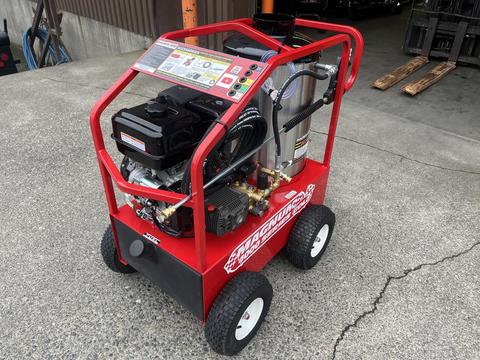 A red 2024 Easy Kleen Magnum 4000 hot water pressure washer with a black engine and multiple control panels on the side