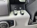 Controls and buttons on the dashboard of a 2017 Ford F-250 SD including a rotary switch and two toggle buttons for functions labeled ROTO and BACK UP
