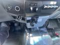 Interior of a 2016 Ford F-350 SD showing the gear shifter cup holder and various control switches on the dashboard