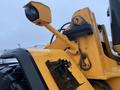 Close-up of a yellow 2016 Hyundai HL940 wheel loader showing the hydraulic arm and camera attachment on the front of the machine