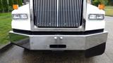 Front view of a 2019 Western Star Trucks 4900 with a shiny chrome bumper and a distinctive vertical grille design