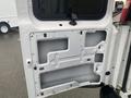 A 2012 Chevrolet Express van door with its inner panel removed exposing the inner structure and wiring