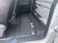 Interior view of a 2013 Ford F-150 cab showing the floor with seating area and storage spaces