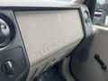 The dashboard of a 2010 Ford F-250 SD featuring a textured surface with the words SUPER DUTY prominently displayed