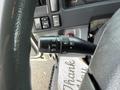 A close-up view of the turn signal and cruise control lever on a 2015 Isuzu NPR HD steering column