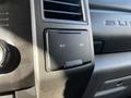 Interior panel of a 2018 Ford F-550 showing two 12V power outlet slots above a circular air vent and adjacent to the dashboard