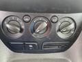 Climate control knobs and buttons from a 2017 Ford Transit Connect dashboard featuring temperature and fan speed controls