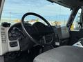 Interior of a 2008 International 4300 truck showing the steering wheel dashboard and control panel