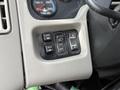 Control panel of a 2016 International 7600 featuring switches for mirror adjustment panel lights and exterior lights