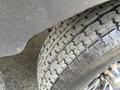 Close-up of a treaded tire from a 2013 Outdoor Wind River displaying a rugged design for off-road performance