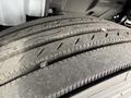 Close-up of the worn tire on a 2017 Hino 338 showing significant tread wear and exposed rubber