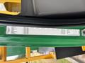 A 2015 Freightliner M2 106 with a green interior panel displaying specifications and component details for the vehicle