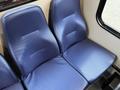Blue vinyl seats inside a 2020 Chevrolet Express van with a textured surface and a modern design