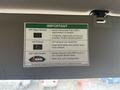A label inside a vehicle, providing important information about diesel particulate filter regeneration, hot exhaust, and diesel exhaust fluid refill instructions